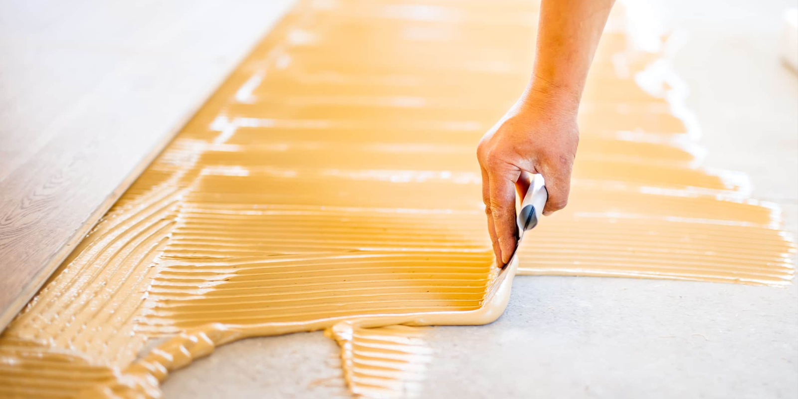 Flooring adhesive bonding strength and selection